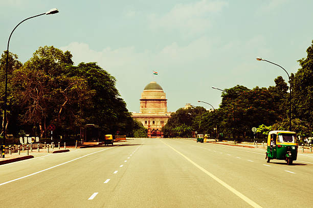 istock Road leading towards a government building 493080526