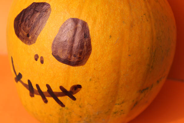 istock Halloween Pumpkin, funny Jack O'Lantern on orange background 493081412