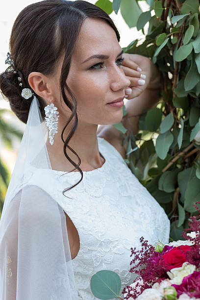 istock Beautiful bride outdoors with a bouquet 493081986