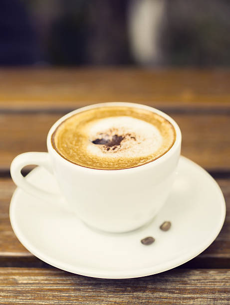 istock Cup of cappuccino on a wooden table 493082306