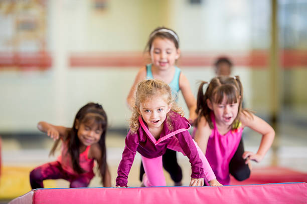 istock Little Girls Doing a Gym Obstacle Course 493082658