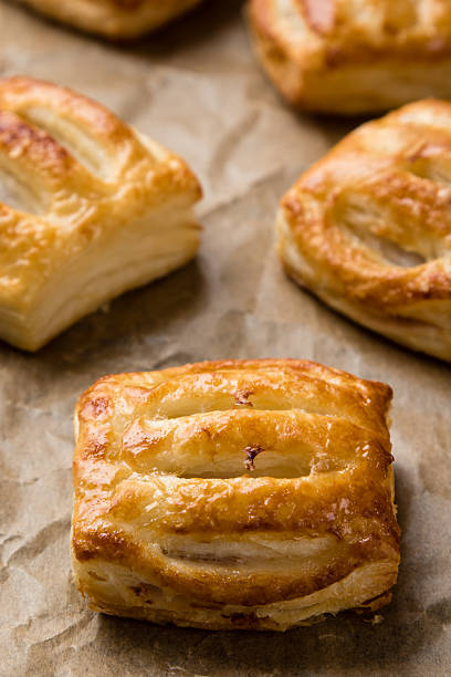 istock sweet puff pastry on paper 493084728