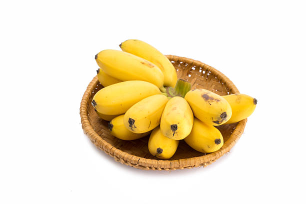 istock Bunch of bananas isolated in basket on white background 493086148