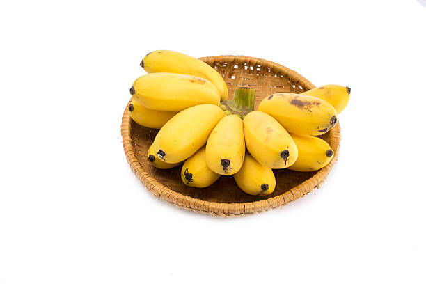 istock Bunch of bananas isolated in basket on white background 493086208