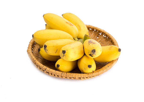 istock Bunch of bananas isolated in basket on white background 493086238