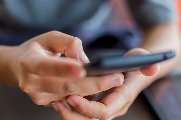 istock Women Use Smartphone for Business in Cafe 493086500