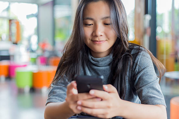 istock Women Use Smartphone for Business in Cafe 493086574