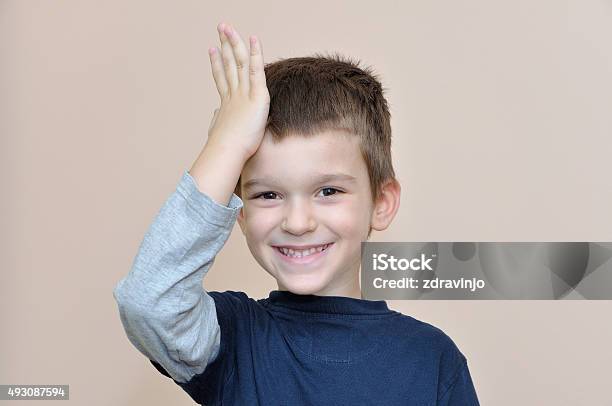 Young Boy Slapping Hand On Head Stock Photo - Download Image Now - Child, Forehead, Boys
