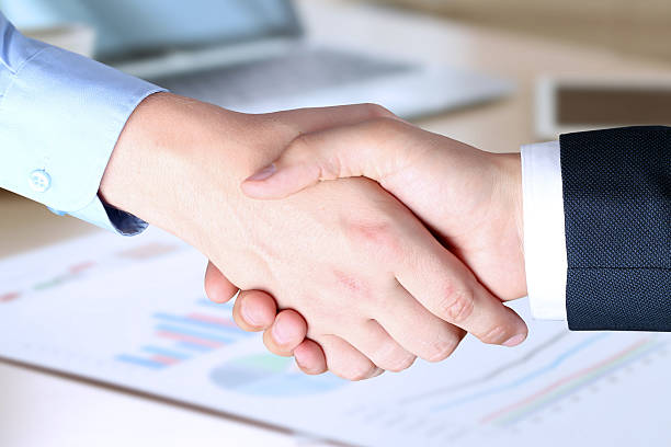 istock Close-up image of a firm handshake in office. 493088106