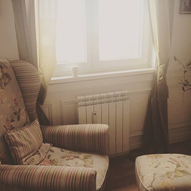 istock Armchair by the window 493089234
