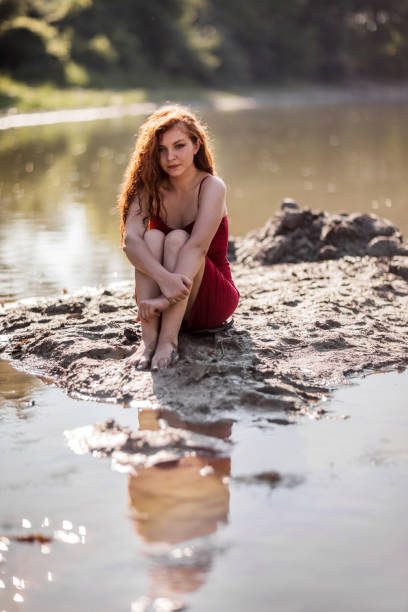 Redhead kid on beach holiday looking at camera