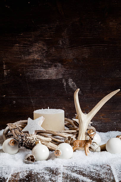 istock Christmas decoration, wreath with white candle, baubles, antler 493106472