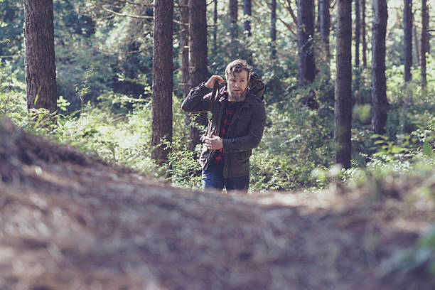 istock Beard man hiking on forest trail. 493106958