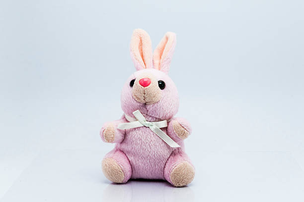 istock Funny knitted rabbit toy isolated on white background 493107772