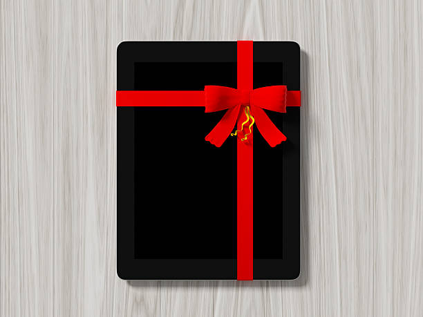 istock tablet wrapped with color ribbon 493108052
