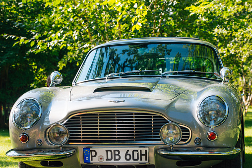 Potsdam, Germany - August 29, 2015: Oldtimer Aston Martin DB5 Vantage on the streets of Potsdam, Germany. This model is famous for its limited production - only 1023 units has been produced between 1963 and 1965, but also as it was James Bond's car in oscar winning 
