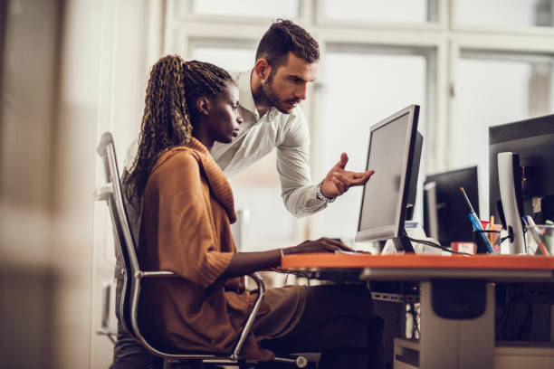 istock Business colleagues working on PC at corporate office. 493110386