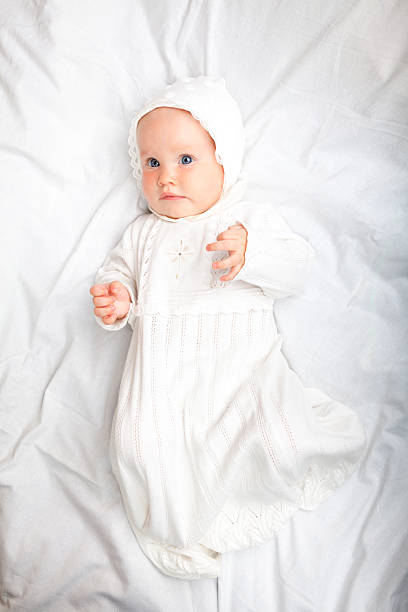 istock Child in baptismal clothes 493111150