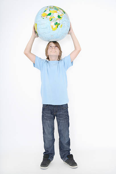 istock Germany,Bavaria,Ebenhausen,boy holding earth globe against white 493113494