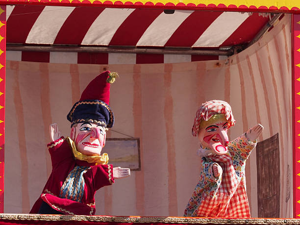 Traditional English Punch and Judy Puppets Wolsingham, England - September 6, 2015: Traditional Punch and Judy puppets at the annual village show in Wolsingham, County Durham.  Punch and Judy puppet shows, originally based on Italian marionette plays from the 17th Century, often feature at shows, fairs and English seaside resorts as children's entertainment. punch puppet stock pictures, royalty-free photos & images