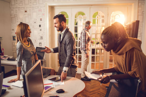 istock Group of multi-tasking business people in the office. 493113922