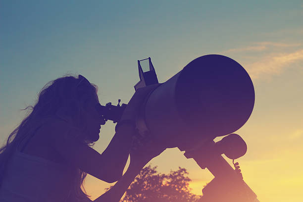 istock Stargazing through a telescope at dawn/dusk 493114476
