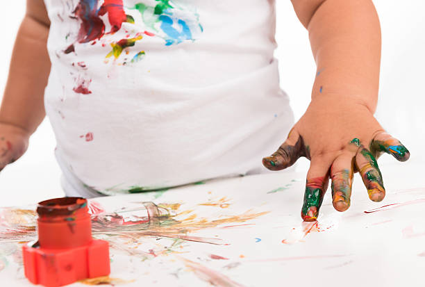 istock child's hand and colors 493114558