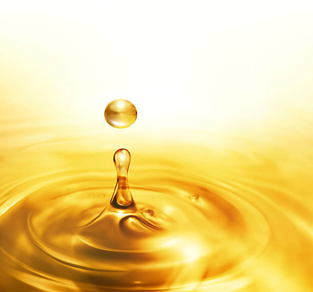 dripping oil bright dripping oil close up as background lubrication stock pictures, royalty-free photos & images