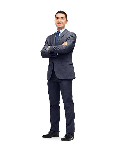 happy smiling businessman in suit business, people and office concept - happy smiling businessman in dark grey suit arms crossed stock pictures, royalty-free photos & images