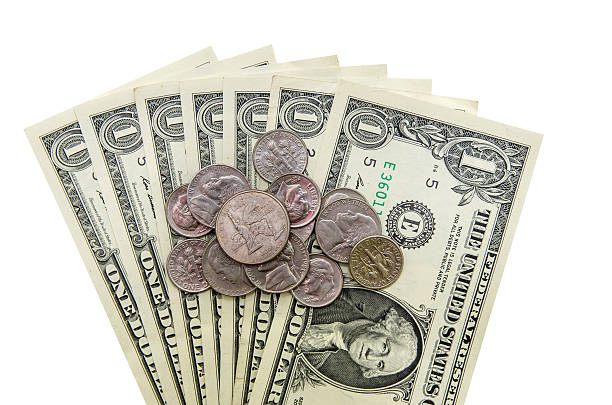 istock American one dollar with different coins isolated on white background 493117238