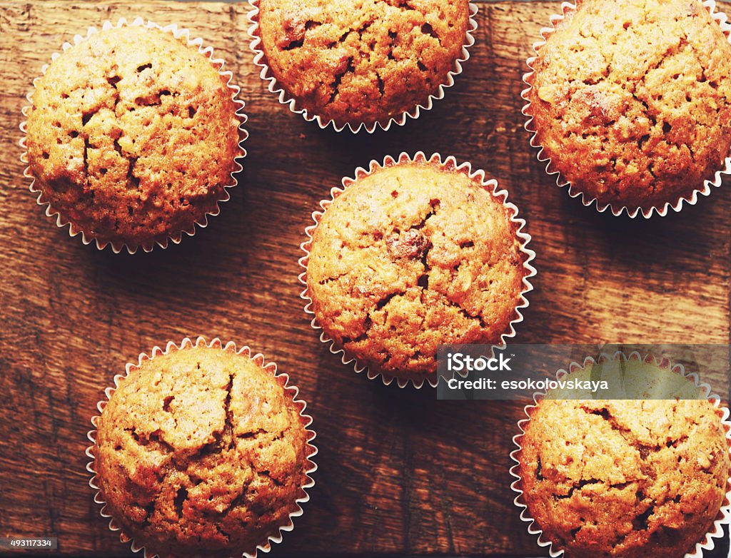 Homemade carrot muffins on brown wooden background Muffin Stock Photo