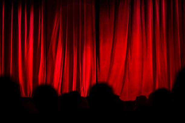 istock theater curtain and audience silhouette 493117860