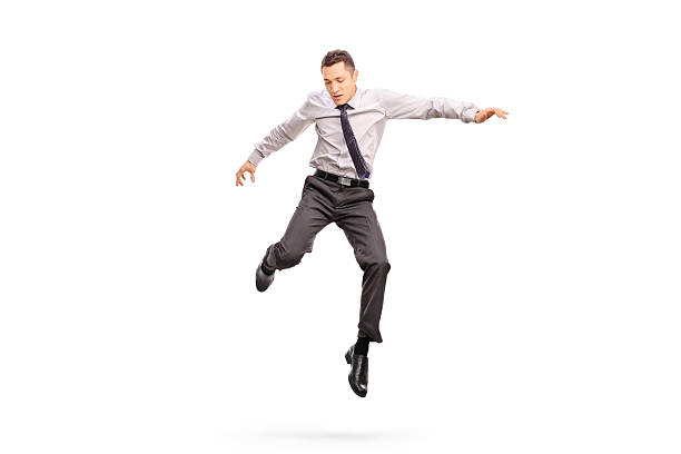 ビジネスマンジャンプの空気と、ふさぎこむ - men businessman jumping levitation ストックフォトと画像