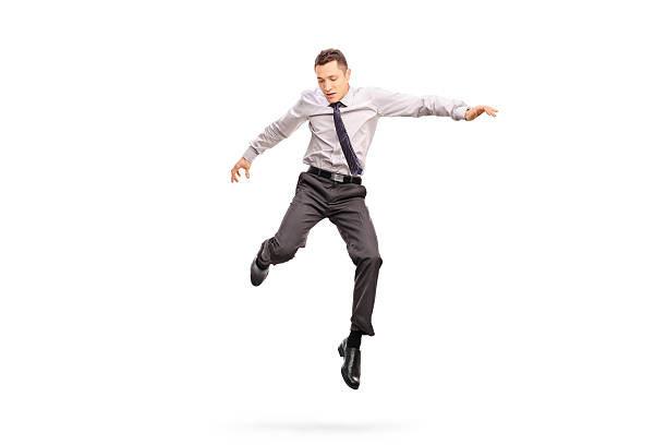 biznesmen skoki w powietrzu i patrzeć w dół - men businessman jumping levitation zdjęcia i obrazy z banku zdjęć