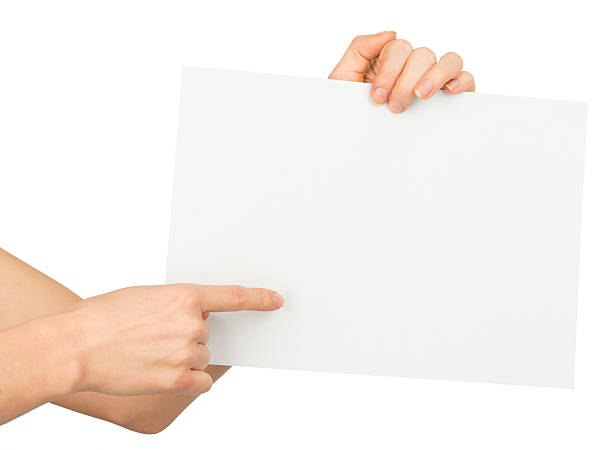 istock Humans right finger pointing at blank paper 493119600