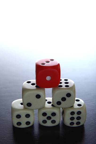 istock One Red dice on top of stacked five white  dice 493119938