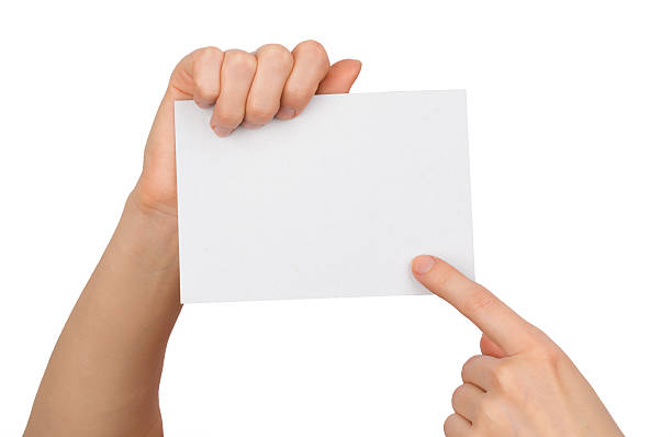 istock Humans right finger pointing at small blank paper 493120364