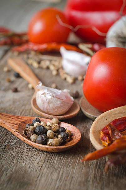 istock Powder spices on spoons in black wooden table background 493120600