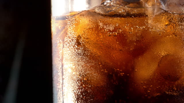 Two videos of cold cola in 4K