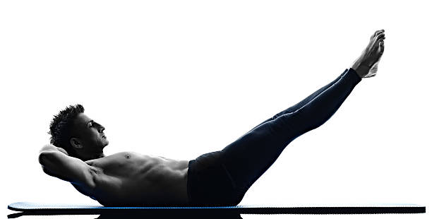 istock man pilates exercises fitness isolated 493149634