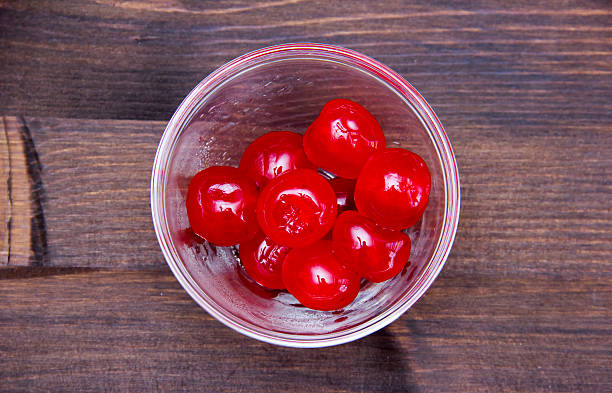 istock Candied cherries on bowl on wood from above 493150260