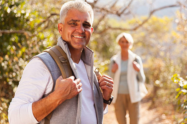istock senior man hiking with wife 493151008