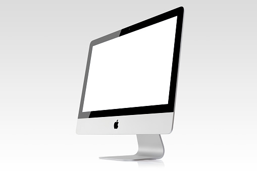 Istanbul, Turkey - September 10, 2015: Apple iMac 21'5 inch desktop computer displaying blank white screen on a white background. iMac produced by Apple Inc.