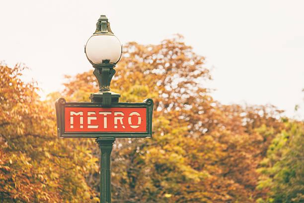 istock Paris metro sign on autumnal background (Paris, France) 493152716