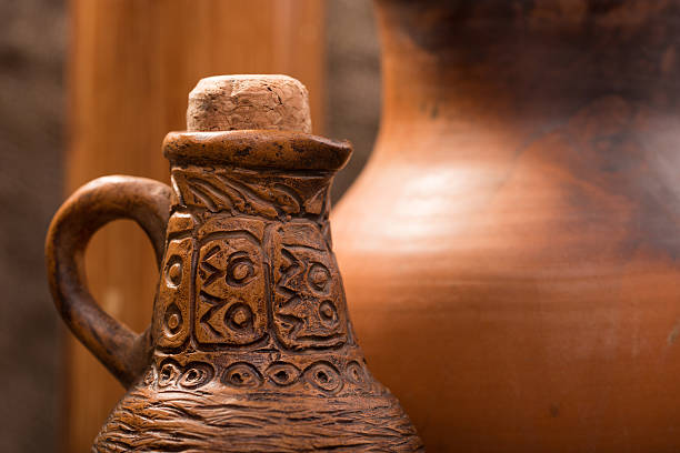 istock clay jug on background of burlap 493152872