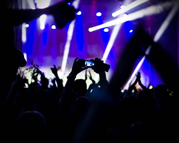 istock Crowd at concert and blurred stage lights 493153564