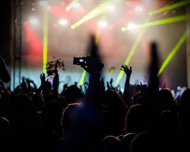 istock Crowd at concert and blurred stage lights 493154614