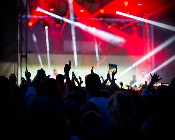 istock Crowd at concert and blurred stage lights 493154688