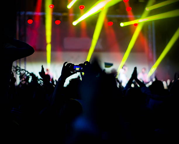 istock Crowd at concert and blurred stage lights 493154766