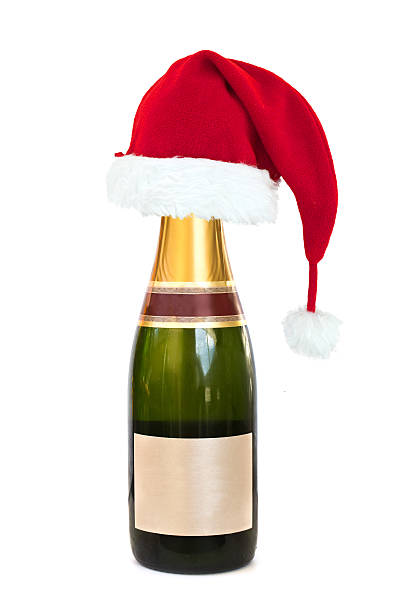 istock Christmas hat on a Champagne bottle with blank label, isolated 493154850
